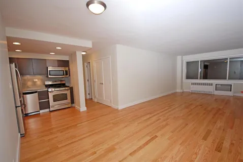 a view of kitchen with sink microwave and refrigerator