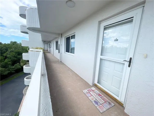 a kitchen with stainless steel appliances a refrigerator sink and cabinets