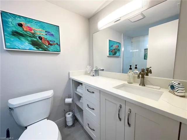 a bathroom with a toilet a bath tub and a shower