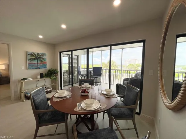 a view of a dining room with furniture window and outside view
