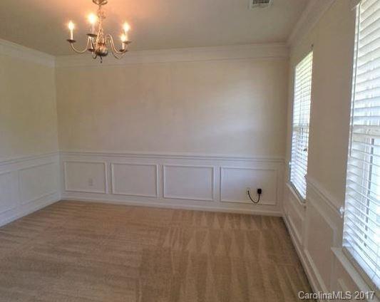 194 Scanlon Road Mooresville, NC 28115 - Photo 4 of 9 wooden floor in an empty room with a window