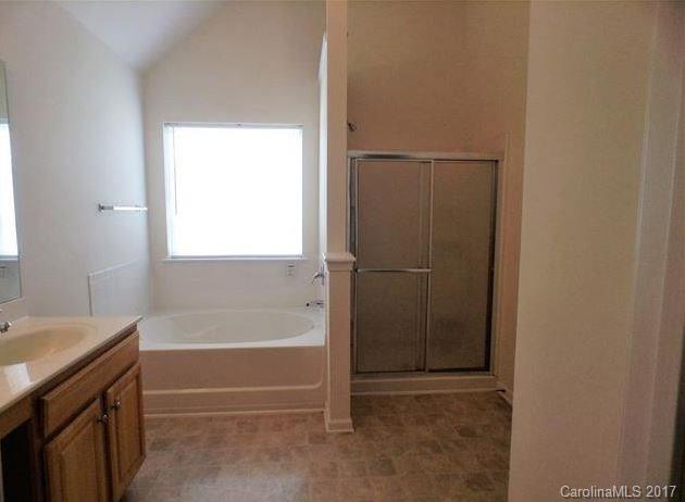 194 Scanlon Road Mooresville, NC 28115 - Photo 5 of 9 a bathroom with a bathtub and a shower