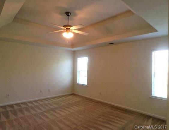 194 Scanlon Road Mooresville, NC 28115 - Photo 6 of 9 an empty room with windows and fan