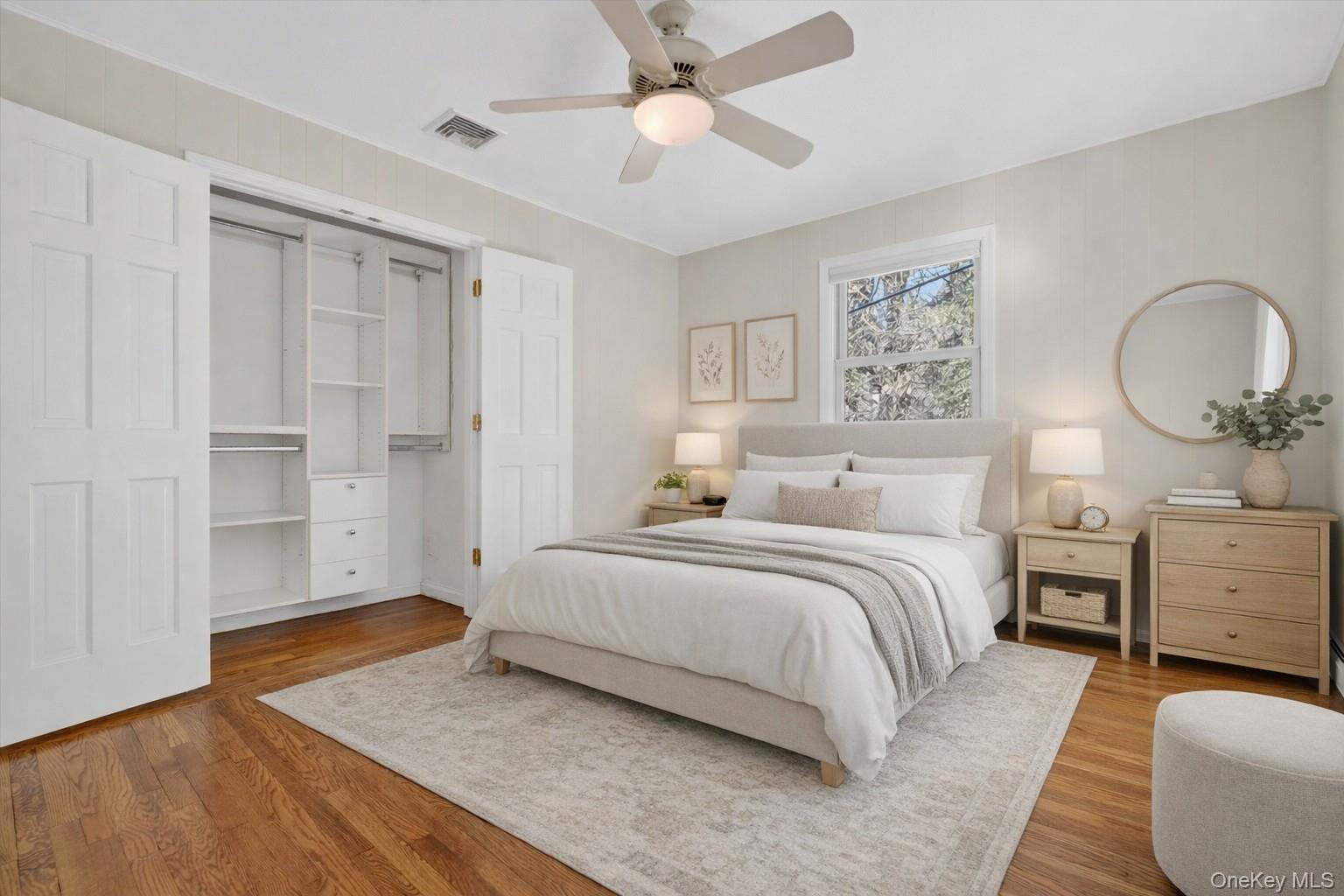 1166 Hunterbrook Road Yorktown Heights, NY 10598 - Photo 15 of 36 a spacious bedroom with a bed and a chandelier