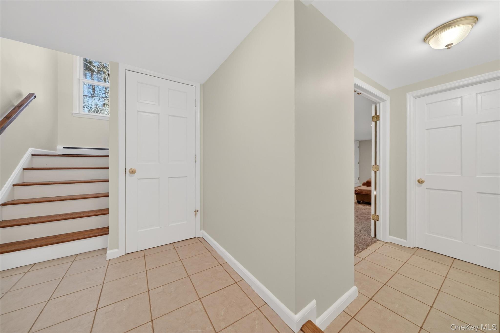 1166 Hunterbrook Road Yorktown Heights, NY 10598 - Photo 20 of 36 a view of an empty room with stairs and closet