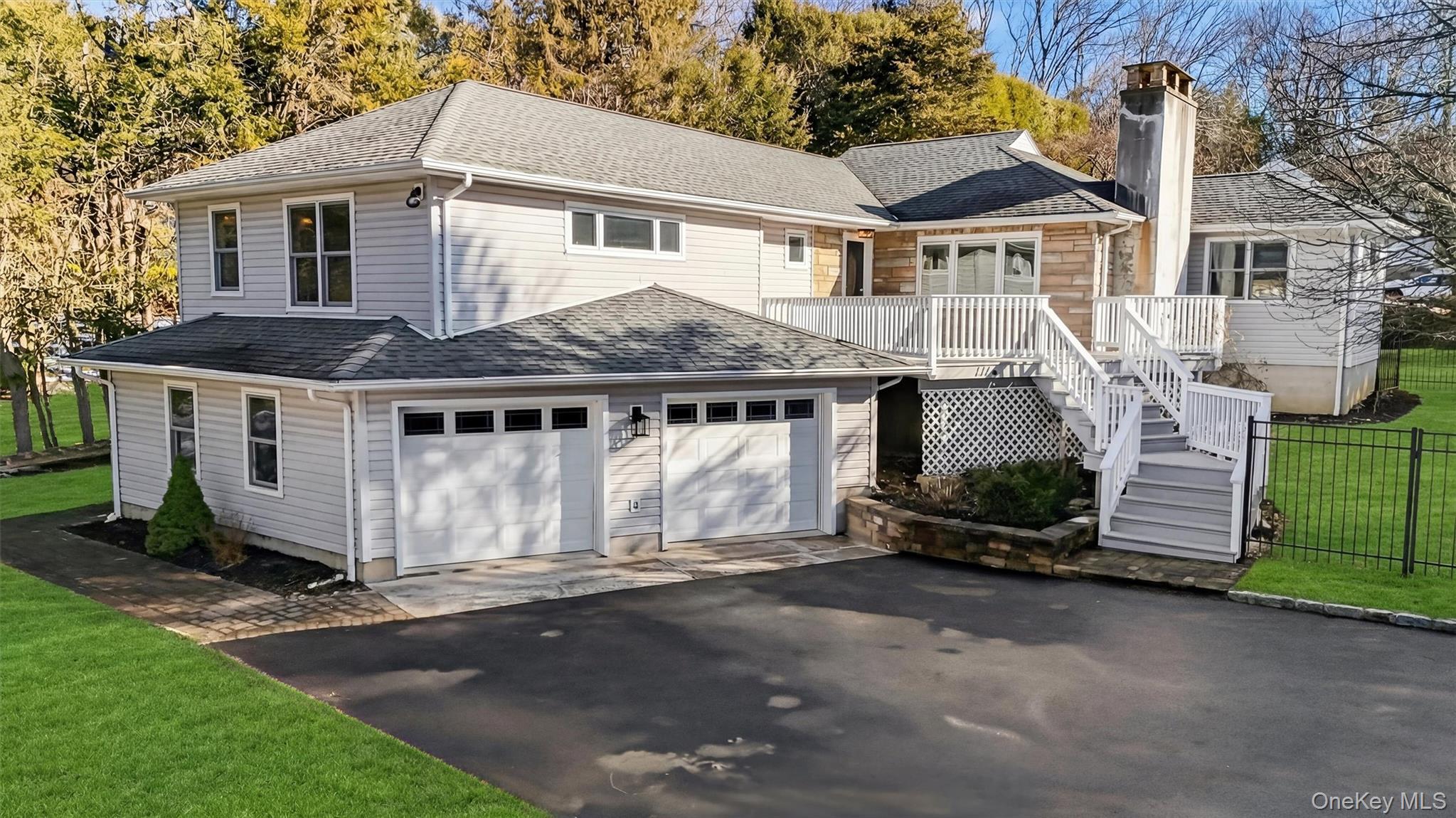 1166 Hunterbrook Road Yorktown Heights, NY 10598 - Photo 2 of 36 a front view of a house with a garage