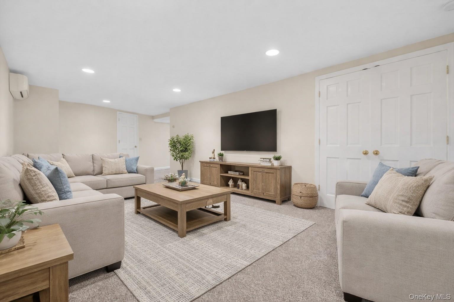 1166 Hunterbrook Road Yorktown Heights, NY 10598 - Photo 21 of 36 a living room with furniture and a flat screen tv