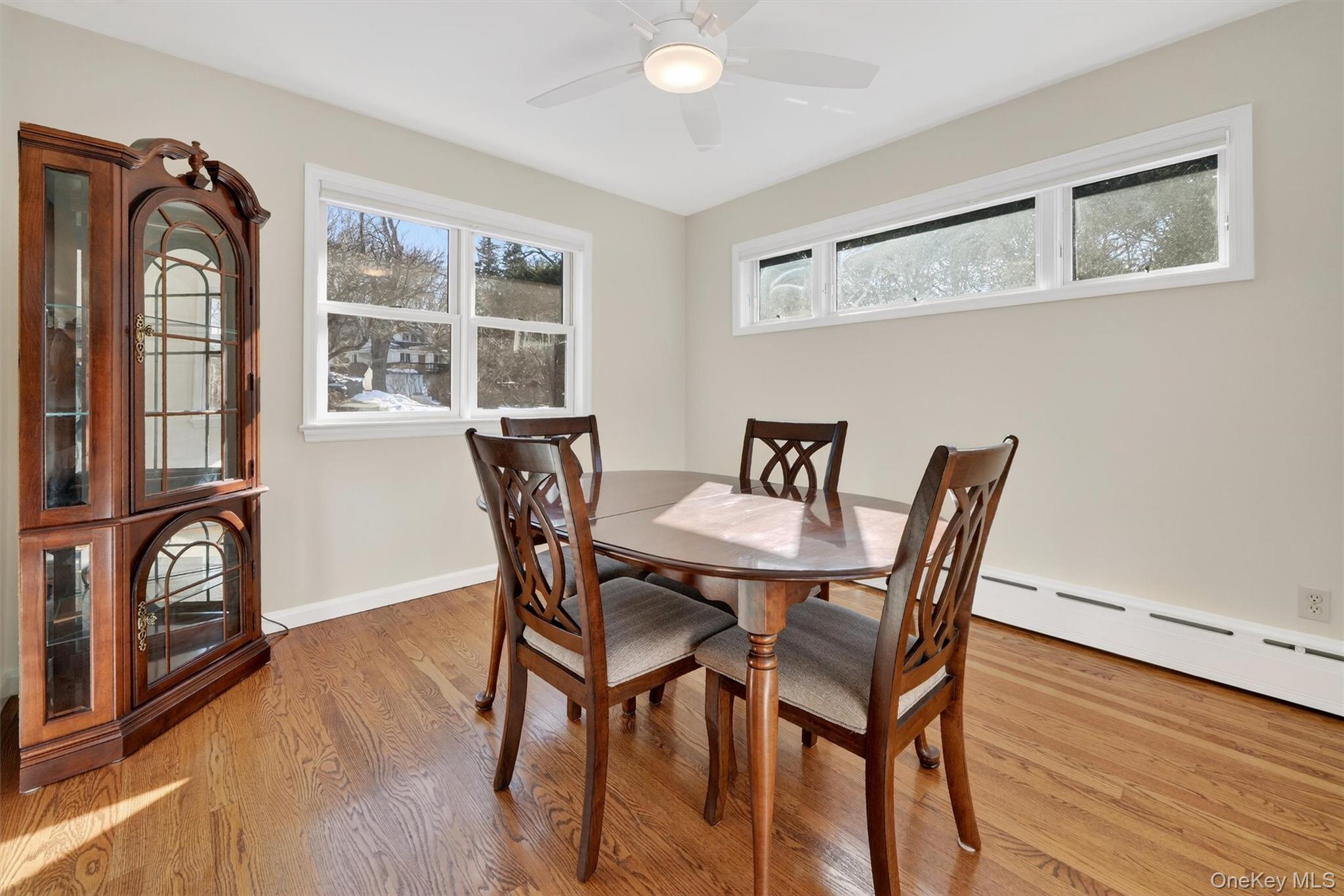 1166 Hunterbrook Road Yorktown Heights, NY 10598 - Photo 10 of 36 a view of a dining room with furniture window and wooden floor