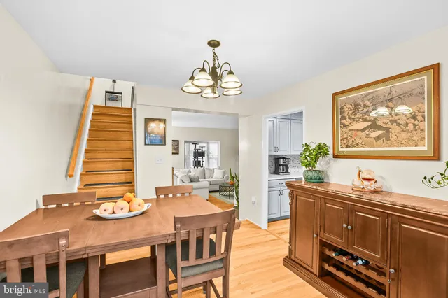 a dining room with wooden floor and breakfast area