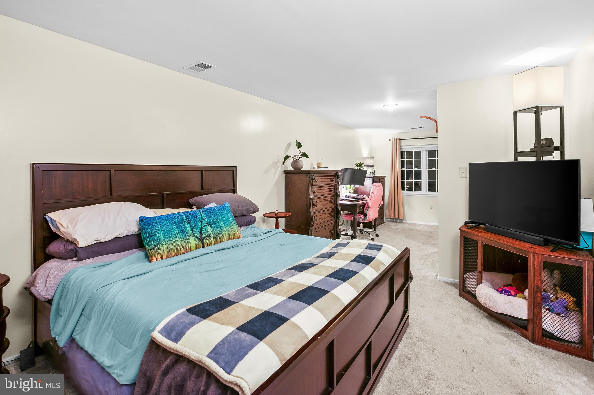 2418 Ridgehampton Court Reston, VA 20191 - Photo 14 of 28 a bedroom with a bed and a flat screen tv