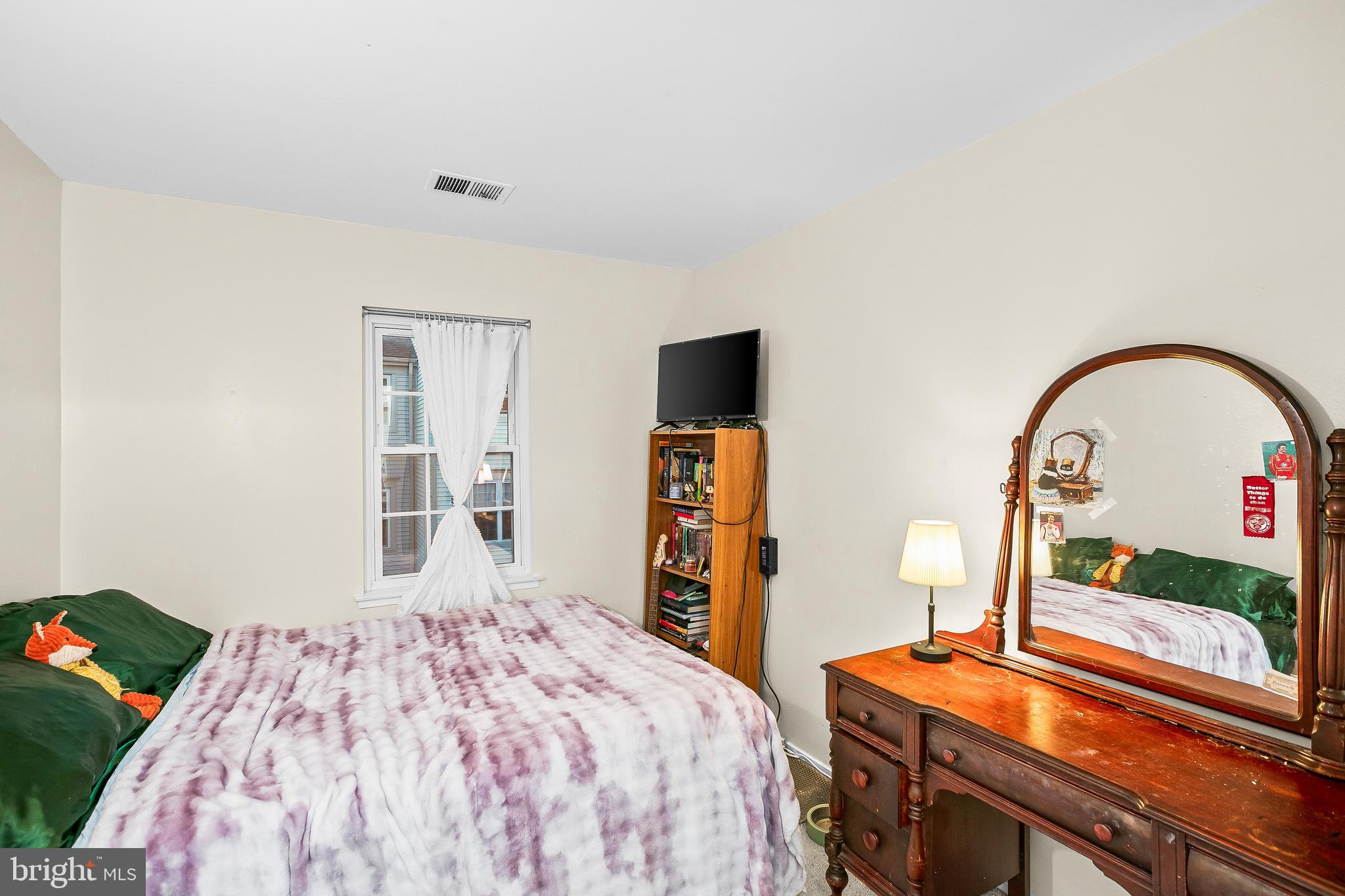 2418 Ridgehampton Court Reston, VA 20191 - Photo 18 of 28 a bedroom with a bed and a flat screen tv