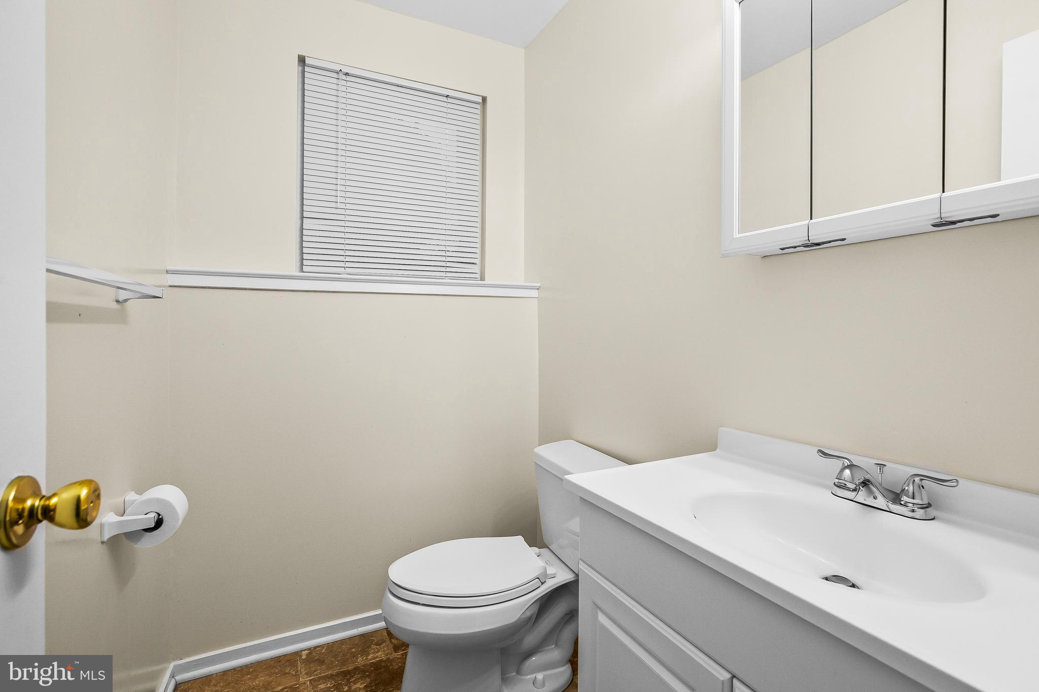 2418 Ridgehampton Court Reston, VA 20191 - Photo 24 of 28 a bathroom with a sink and a toilet