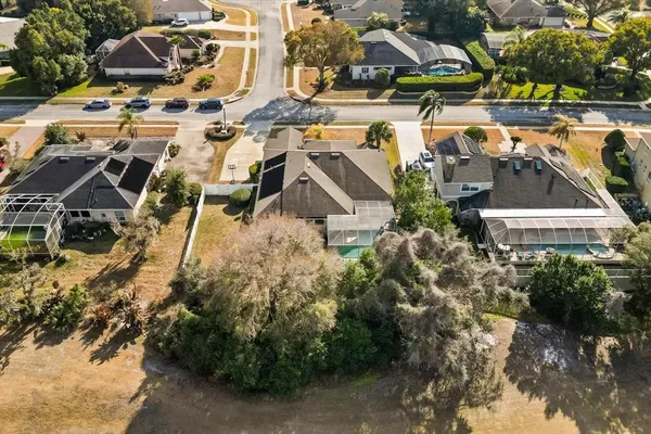 an aerial view of multiple houses with yard