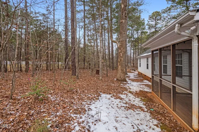 a view of a backyard with pathway