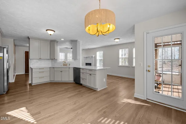 a view of kitchen and wooden floor