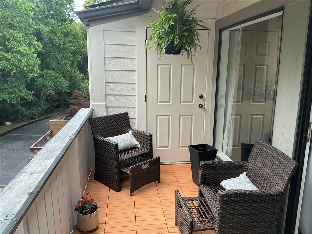 3823 Paces Ferry West Atlanta, GA 30339 - Photo 10 of 33 a balcony with furniture and a potted plant