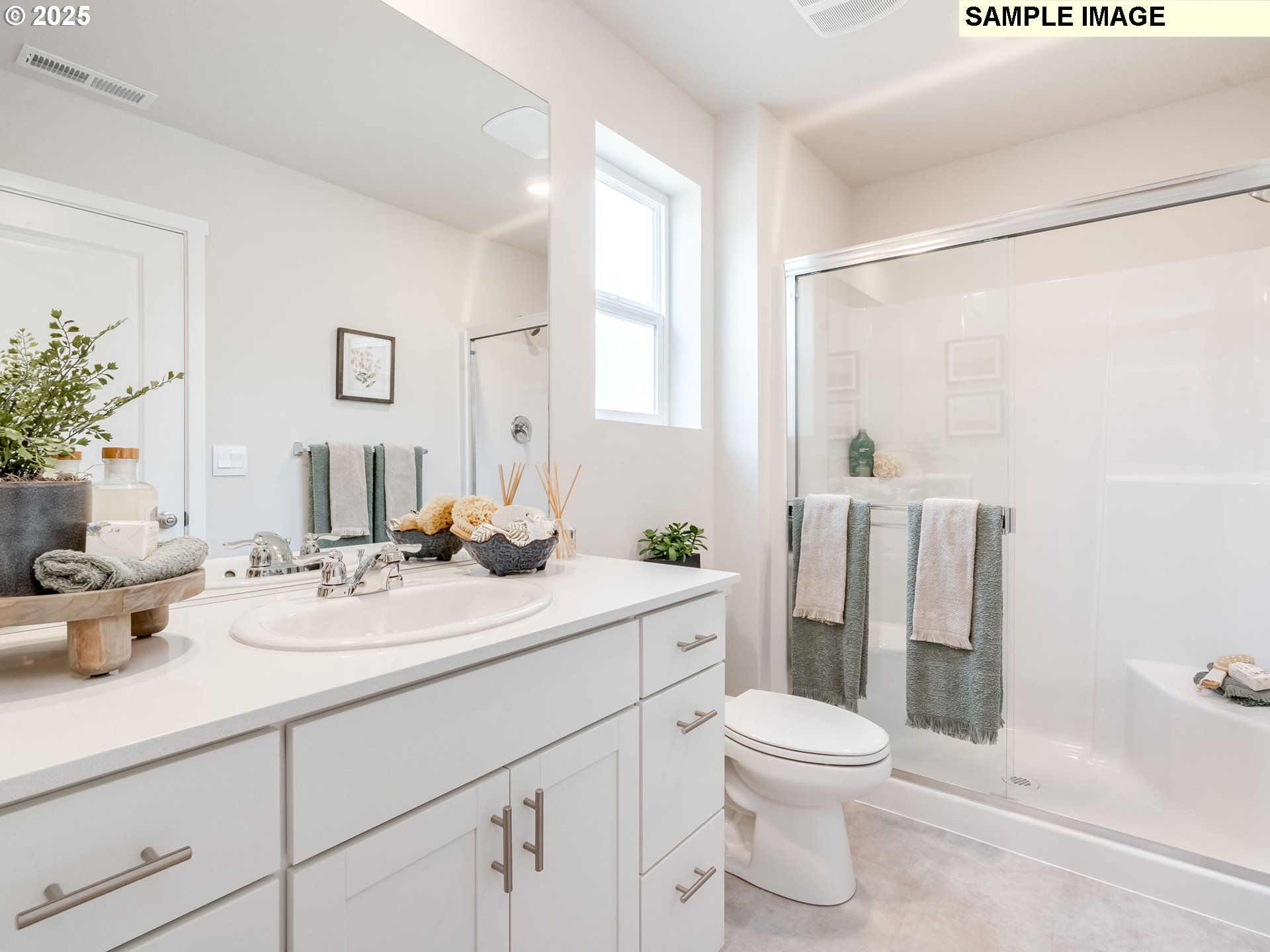 11212 Southeast Maxon Road Vancouver, WA 98664 - Photo 21 of 30 a bathroom with a double vanity sink toilet and shower