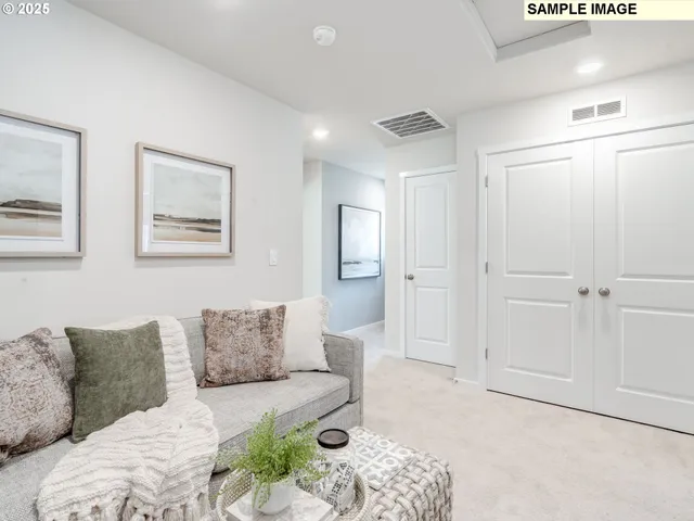 a living room with furniture and a rug