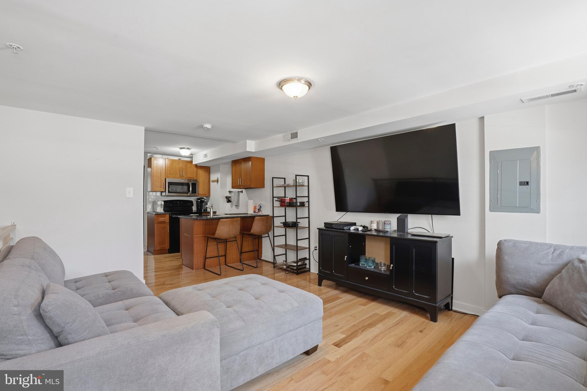 a living room with furniture and a flat screen tv