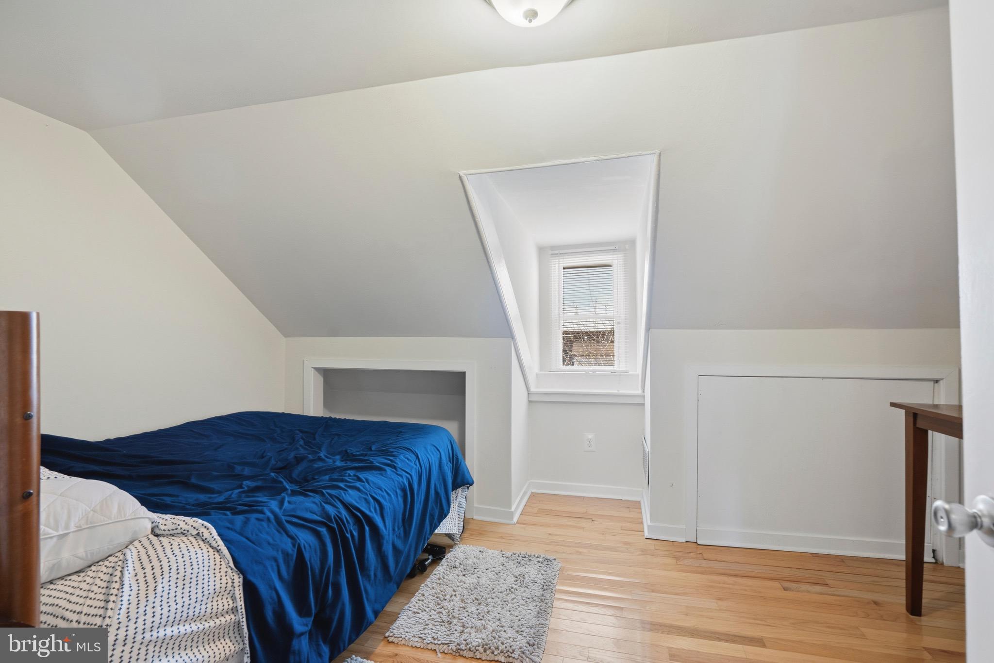 520 South 4th Street, Unit C Philadelphia, PA 19147 - Photo 12 of 18 a spacious bedroom with a bed and wooden floor