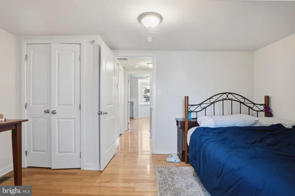 a bedroom with a bed and a view of bathroom