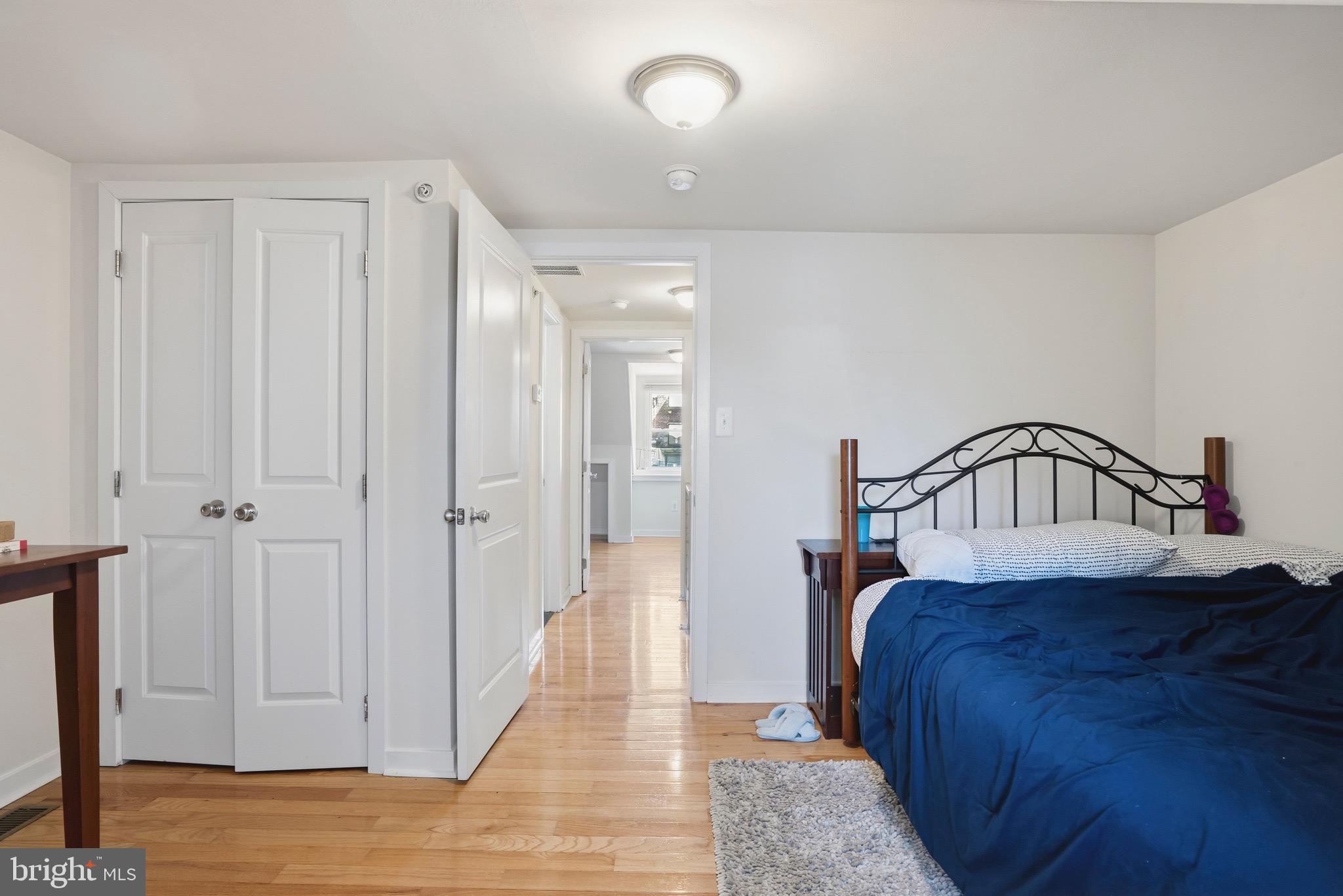520 South 4th Street, Unit C Philadelphia, PA 19147 - Photo 13 of 18 a bedroom with a bed and a view of bathroom
