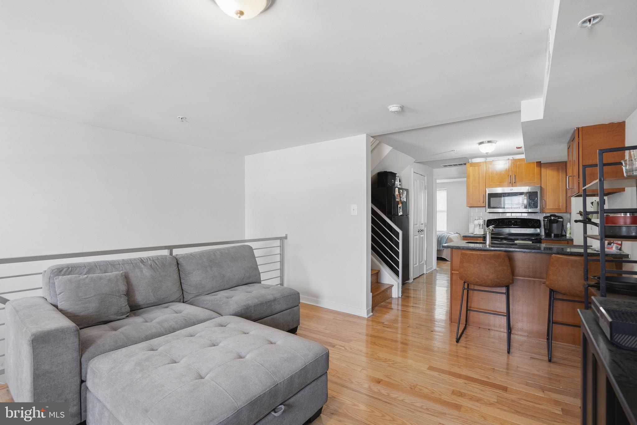 520 South 4th Street, Unit C Philadelphia, PA 19147 - Photo 2 of 18 a living room with furniture and a wooden floor