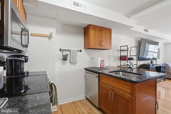 a kitchen with a sink and cabinets