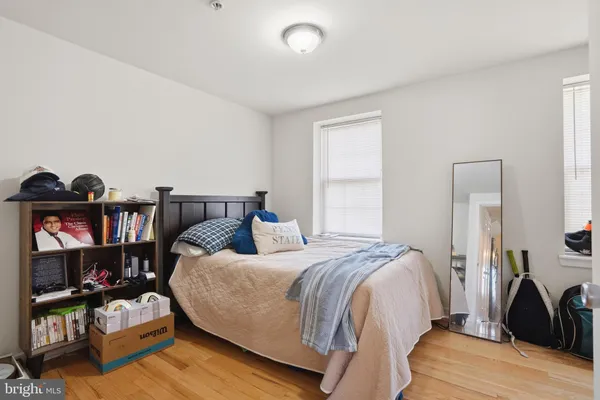 a bedroom with a bed furniture and a window