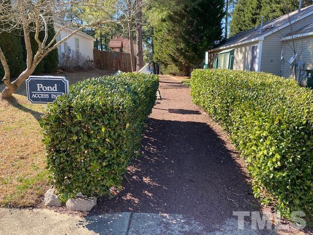 506 Homestead Park Drive Apex, NC 27502 - Photo 17 of 18 a view of a house with a yard and plants