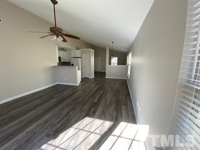 506 Homestead Park Drive Apex, NC 27502 - Photo 3 of 18 a view of empty room with wooden floor and windows