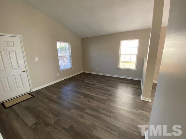 506 Homestead Park Drive Apex, NC 27502 - Photo 6 of 18 an empty room with wooden floor and windows