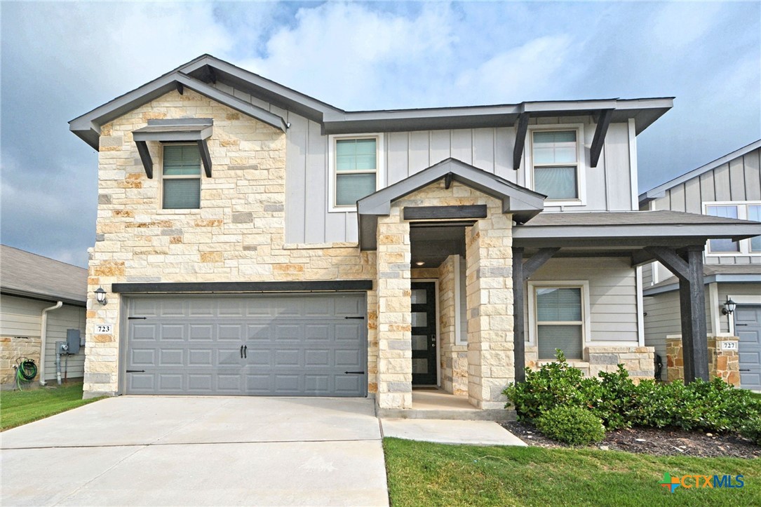 a front view of a house with garage