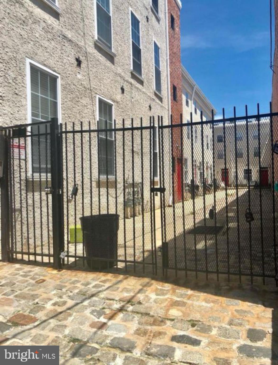 a view of a backyard with a fence