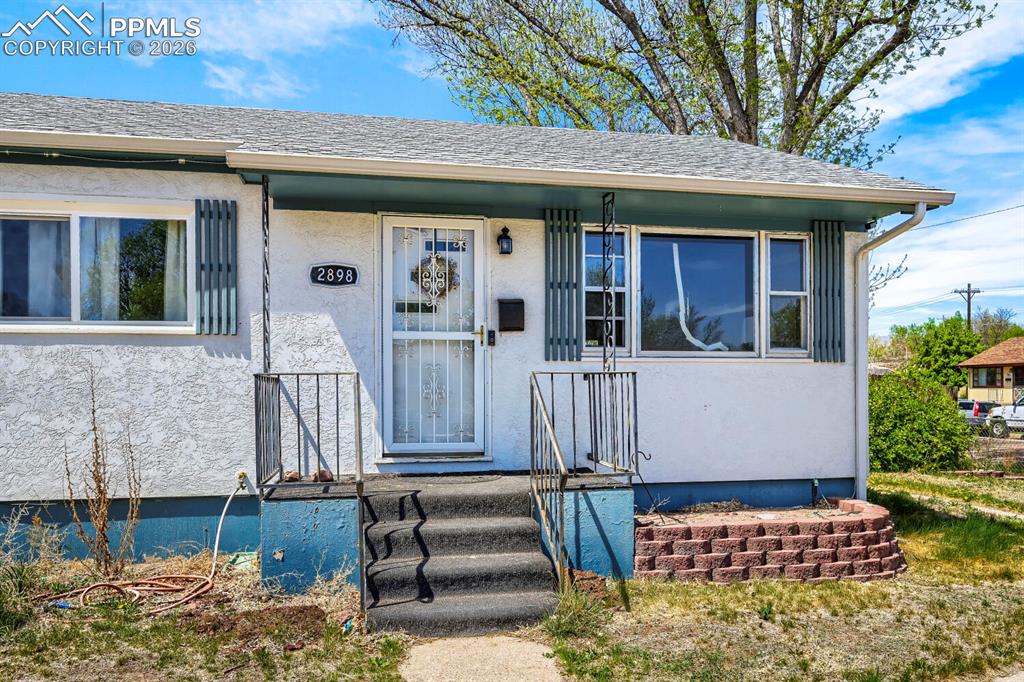 2898 Merry Lane Colorado Springs, CO 80909 - Photo 1 of 19 a view of house with outdoor space