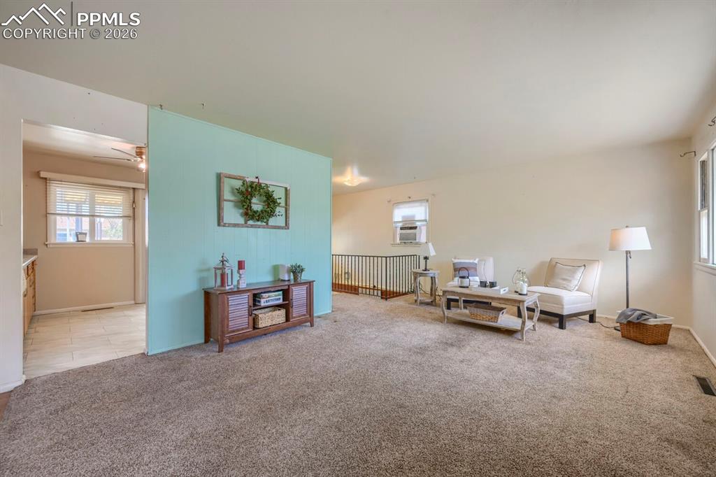2898 Merry Lane Colorado Springs, CO 80909 - Photo 3 of 19 a living room with furniture and a lamp