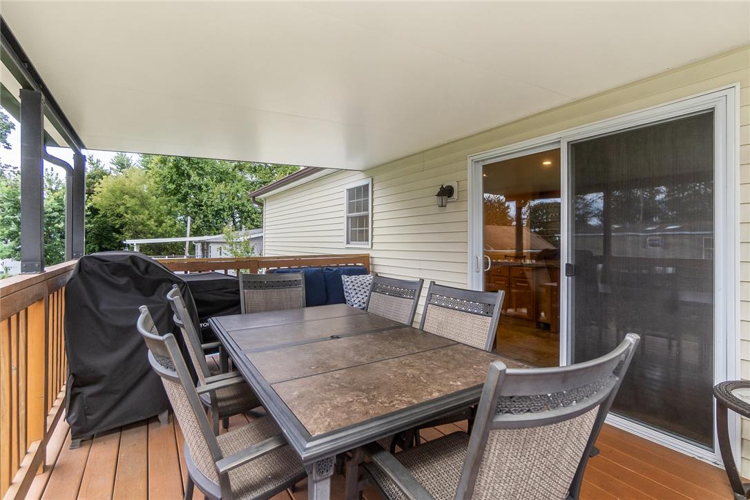 514 Norman Road Nazareth, PA 18064 - Photo 34 of 41 An inviting covered deck features wooden flooring and sliding glass door access.