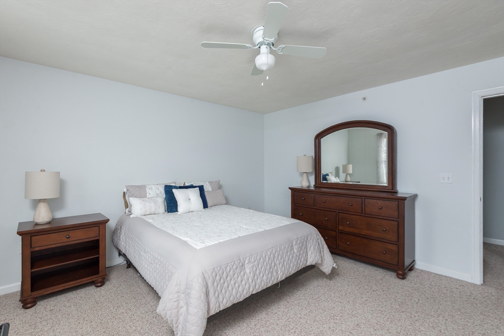 3 Boxberry Lane, Unit 3 Rockland, MA 02370 - Photo 12 of 18 a bedroom with a bed and a dresser