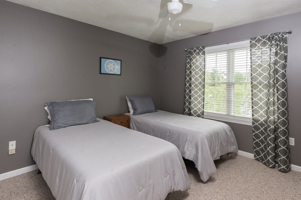 3 Boxberry Lane, Unit 3 Rockland, MA 02370 - Photo 13 of 18 a bedroom with two beds and a large window