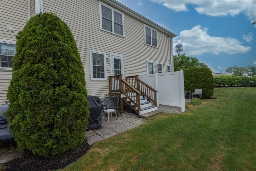 3 Boxberry Lane, Unit 3 Rockland, MA 02370 - Photo 17 of 18 a view of a house with a yard and sitting area