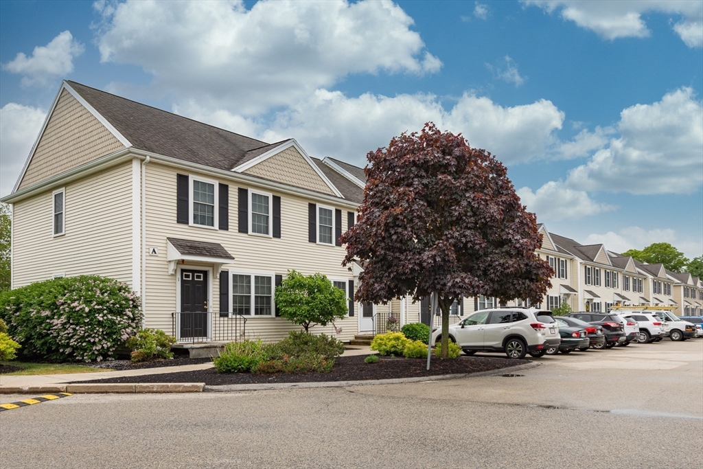 3 Boxberry Lane, Unit 3 Rockland, MA 02370 - Photo 2 of 18 a view of a parked cars in front of a house