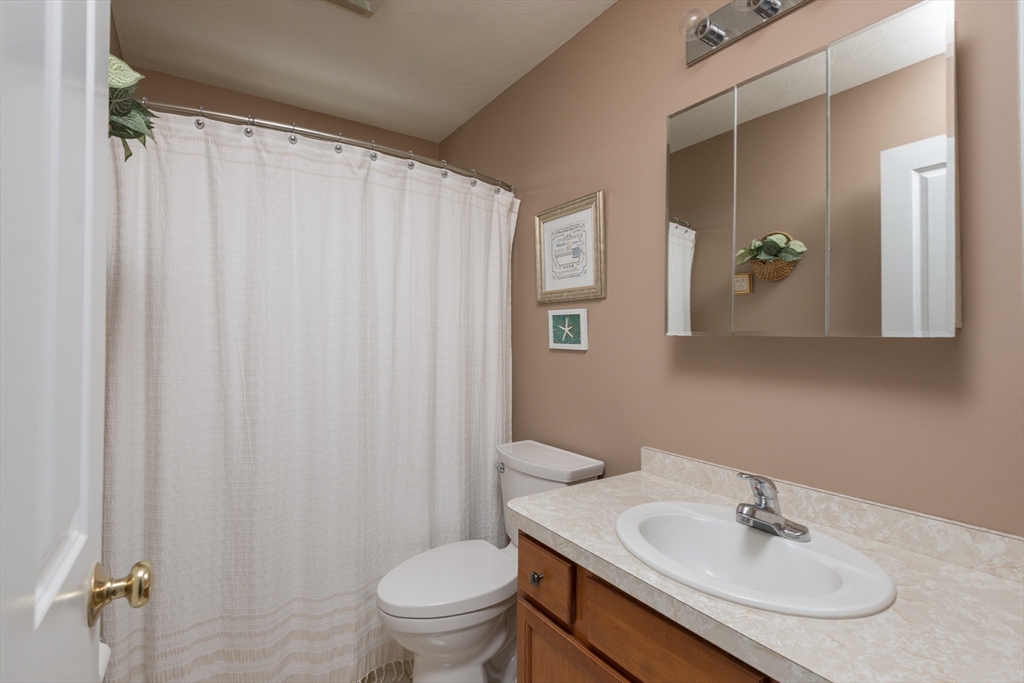 3 Boxberry Lane, Unit 3 Rockland, MA 02370 - Photo 9 of 18 a bathroom with a sink toilet and mirror