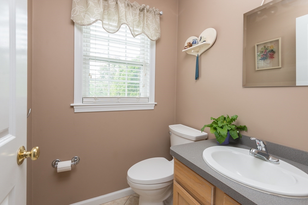 3 Boxberry Lane, Unit 3 Rockland, MA 02370 - Photo 10 of 18 a bathroom with a toilet sink and mirror
