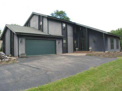 2559 Sun Valley Road Lisle, IL 60532 - Photo 1 of 1 a front view of a house with a garage