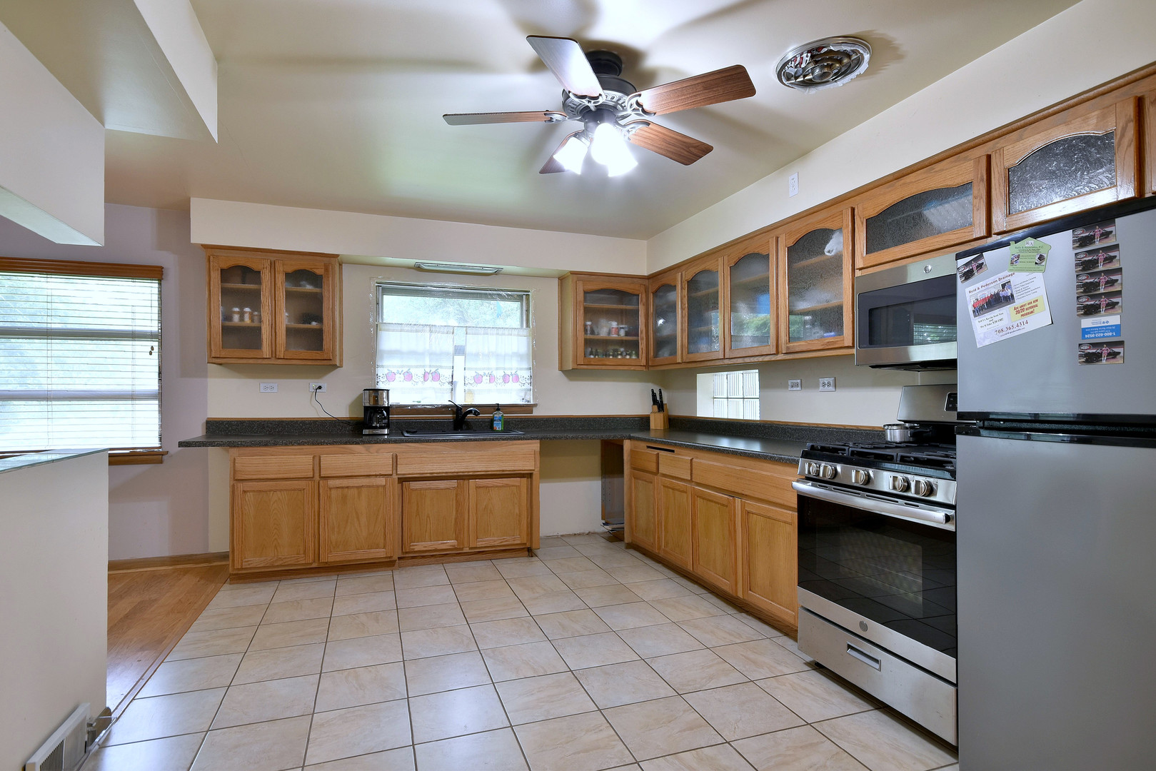 17841 Howe Avenue Homewood, IL 60430 - Photo 26 of 38 a kitchen with stainless steel appliances granite countertop a stove a sink and a refrigerator