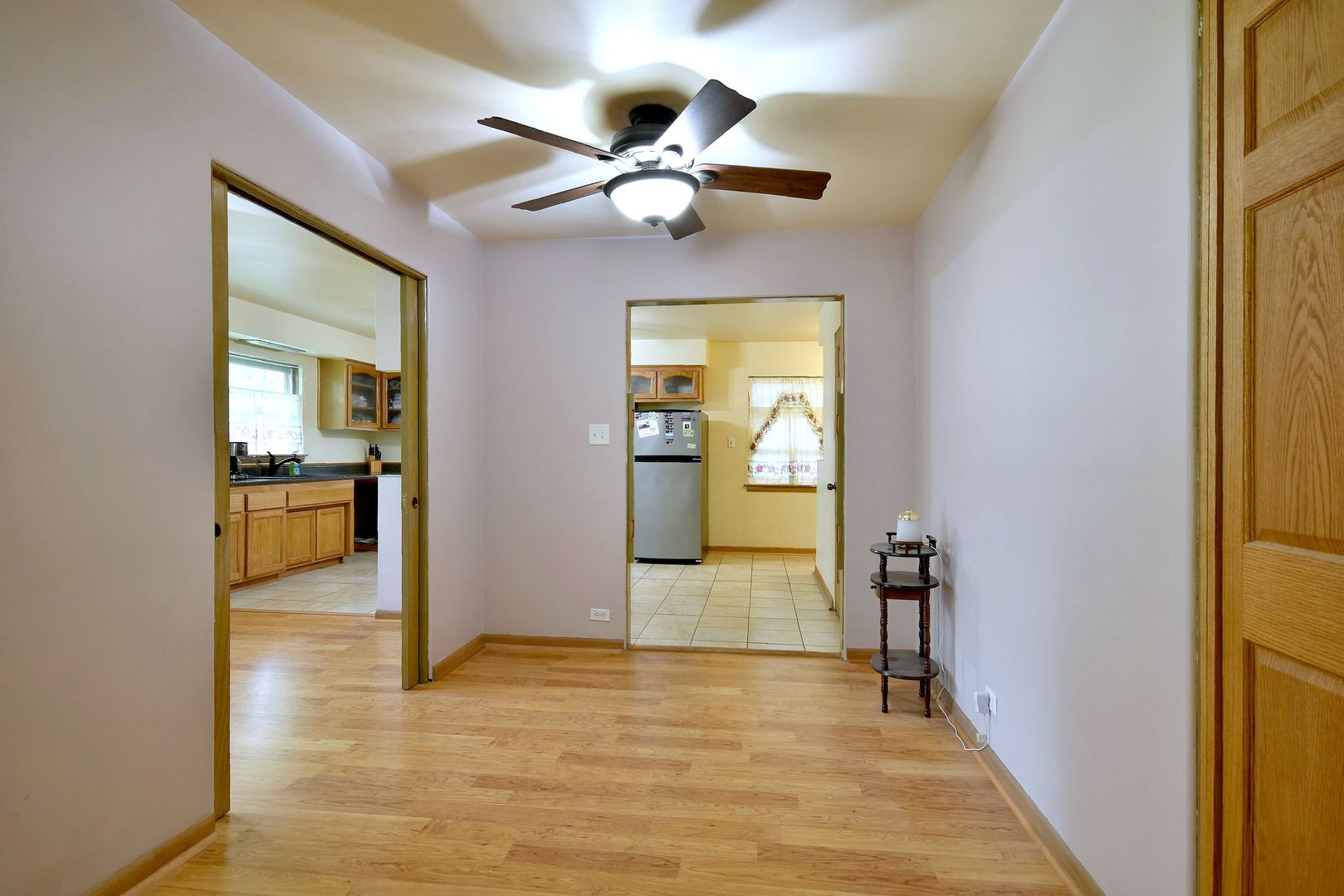 17841 Howe Avenue Homewood, IL 60430 - Photo 31 of 38 a view of a livingroom with a chandelier fan and a large window