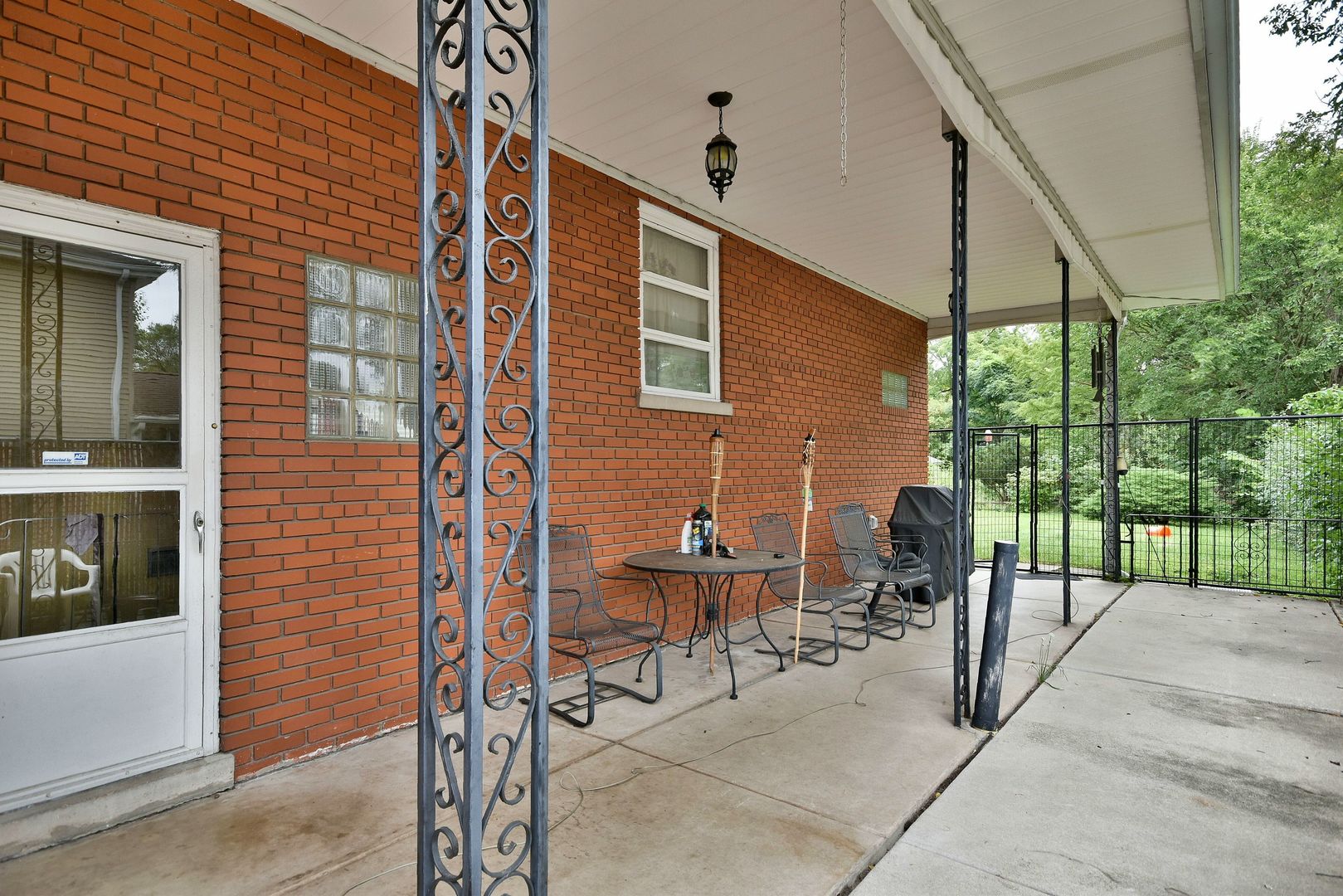 17841 Howe Avenue Homewood, IL 60430 - Photo 8 of 38 a view of a patio with a table and chairs and floor to ceiling window