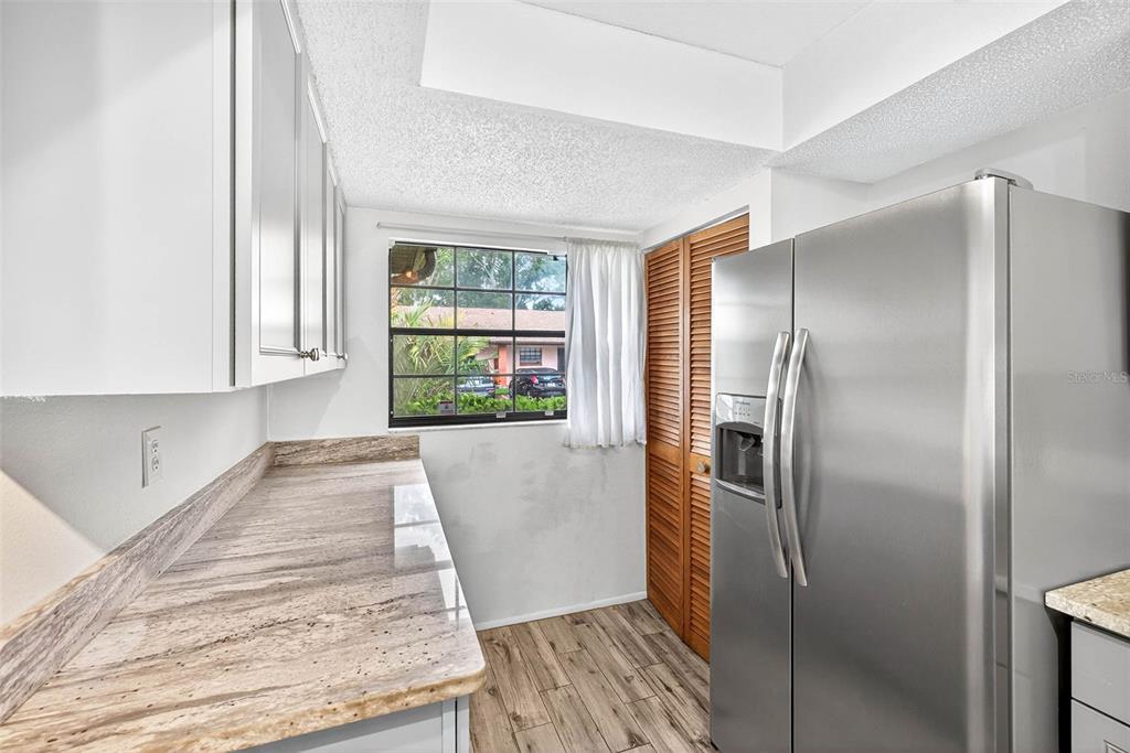 13250 Ridge Road, Unit 21 Largo, FL 33778 - Photo 16 of 36 a bathroom with a bathtub and shower