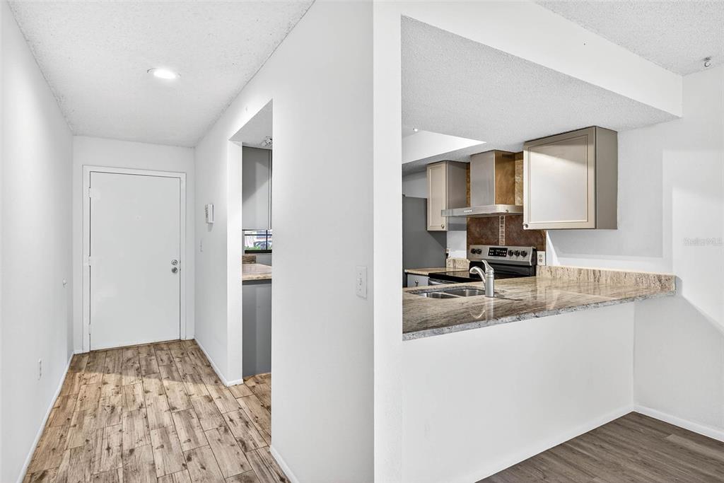 13250 Ridge Road, Unit 21 Largo, FL 33778 - Photo 17 of 36 a bathroom with a sink and a mirror