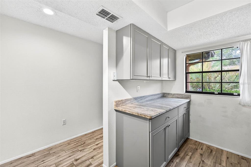 13250 Ridge Road, Unit 21 Largo, FL 33778 - Photo 30 of 36 a utility room with a sink dryer and washer
